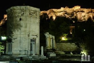 Башня ветров в вечерней подсветке.